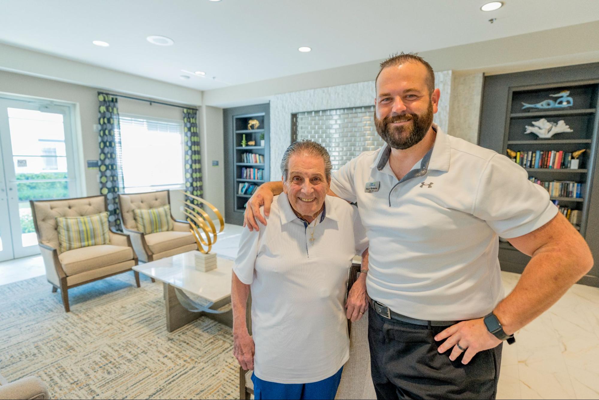 A resident and a team member smiling together at Alamar Senior Living