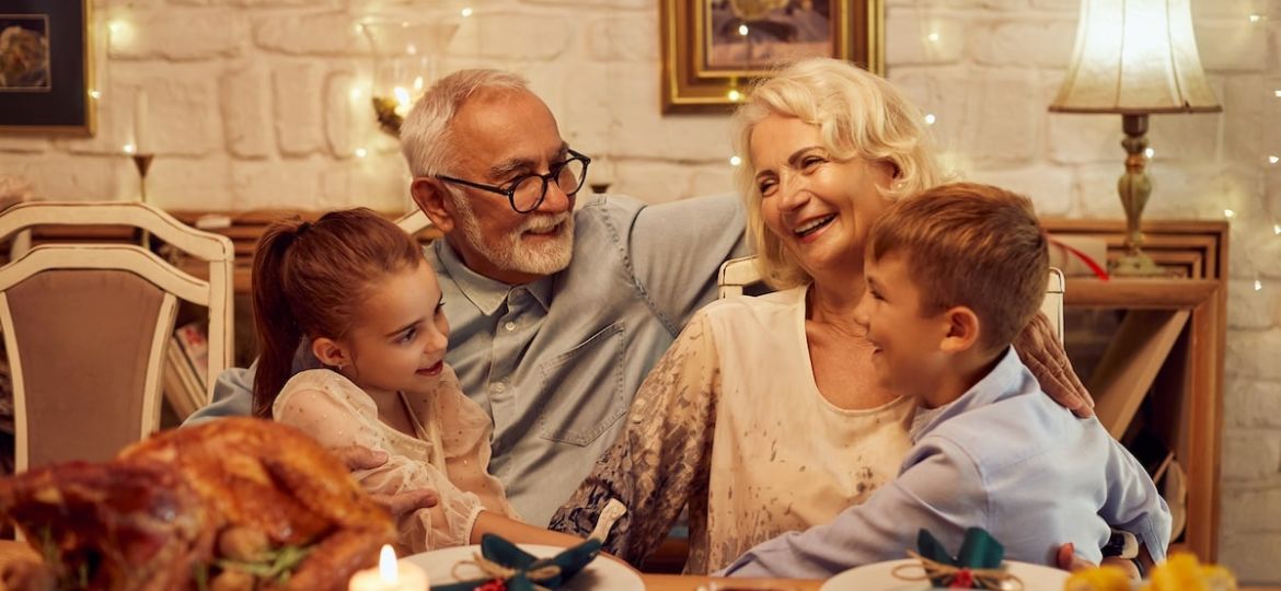 Family enjoys dinner together with seniors