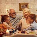 Family enjoys dinner together with seniors
