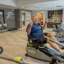 An older adult exercises at Alamar Senior Living to help prevent falls