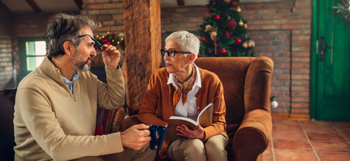 A resident at Alamar Senior Living making a care plan with her son for the holiday season
