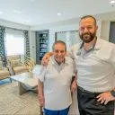 A resident and a team member smiling together at Alamar Senior Living