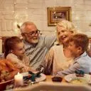 Family enjoys dinner together with seniors